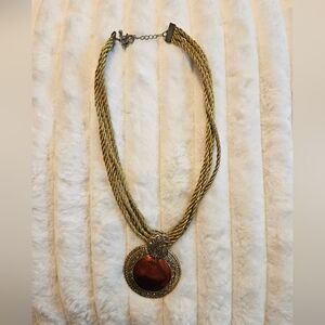 Gold rope necklace with pendant